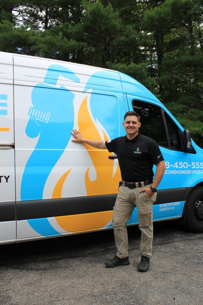 The Perricone Home Services owner standing in front of a branded plumbing service van.